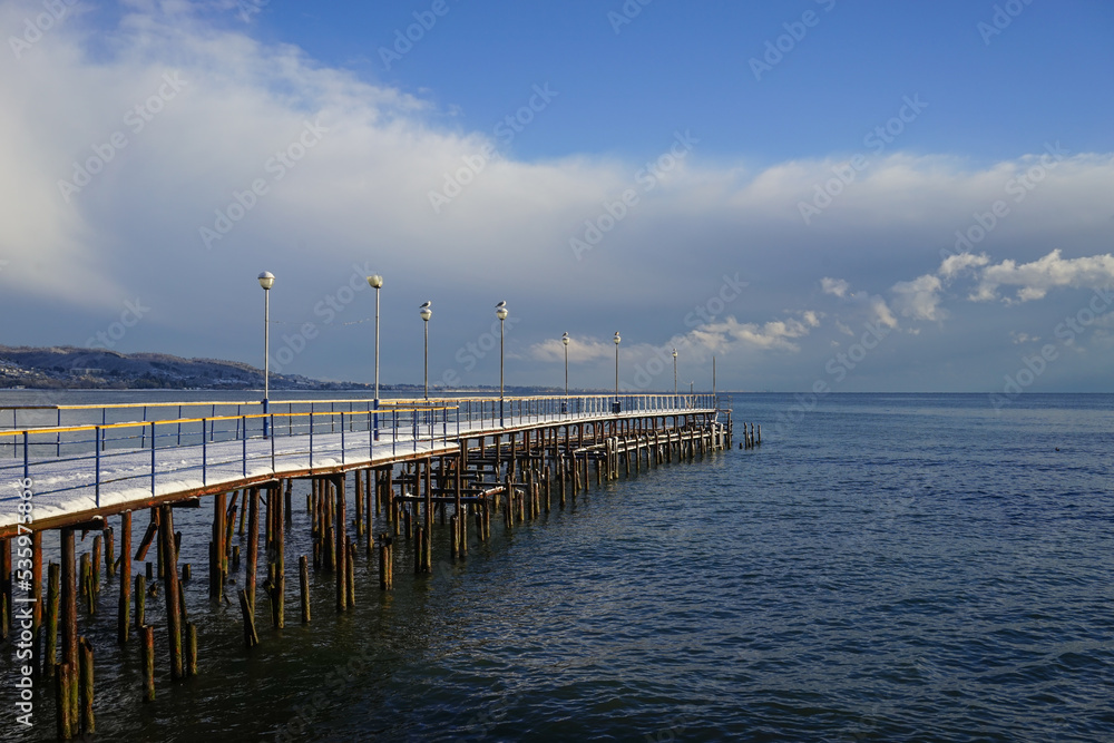 Marine boat dock in a sub-tropical country under a layer of snow