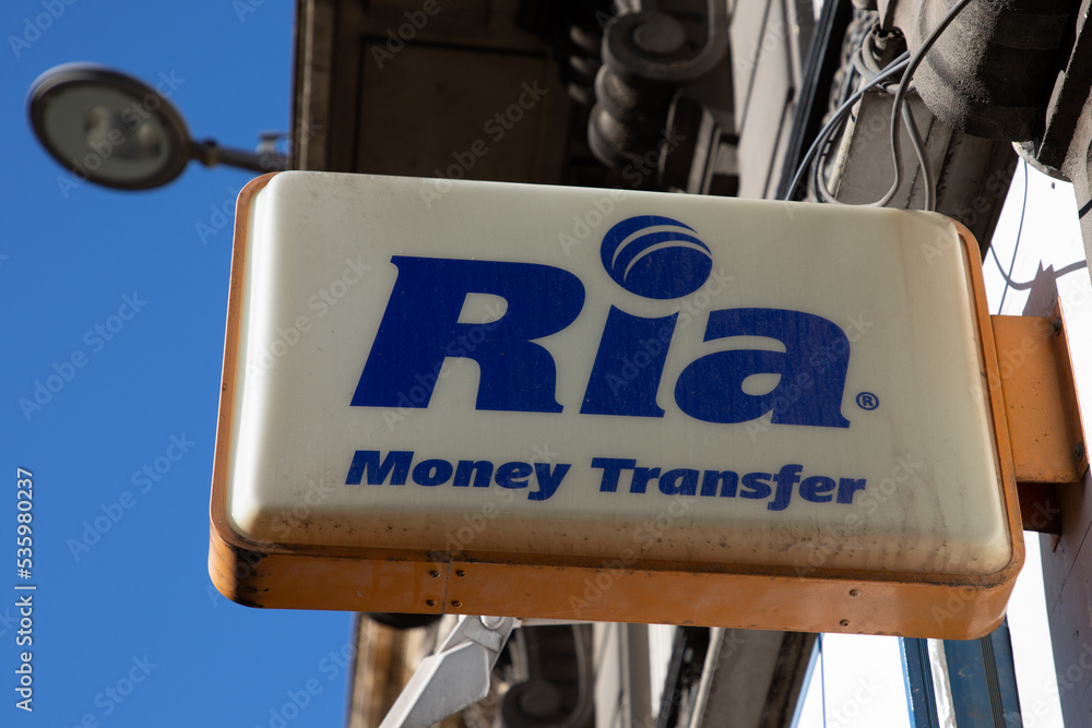 ria Money Transfer text brand and sign logo wall agency facade Money