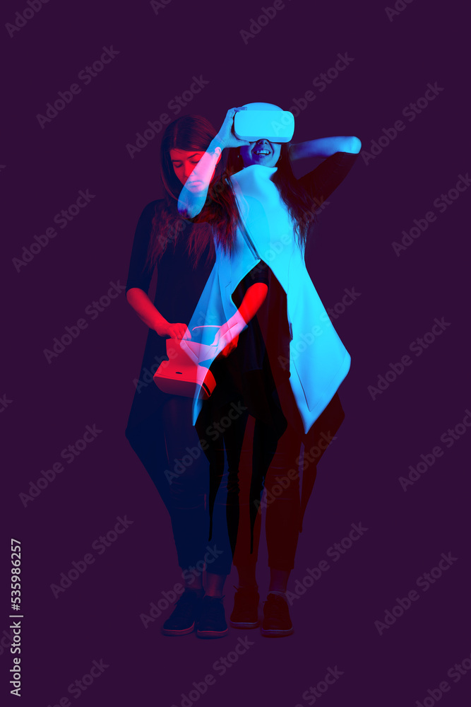 Fototapeta premium Woman is using virtual reality headset. Image with double color exposure effect.