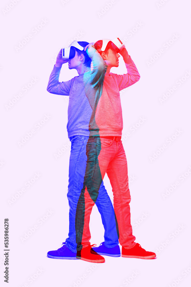 Man is using virtual reality headset. Image with double color exposure effect. Man is using virtual reality headset. Image with double color exposure effect.