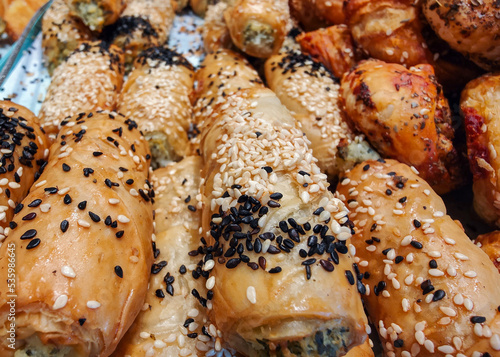 Mash potato-filled pastries covered with black and white sesame for sale