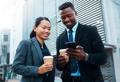 Coffee  phone and businessman and woman in the city  talking or social media while drinking espresso. Chatting  tea and Asian female and black male speaking or on 5g mobile app on a break together.