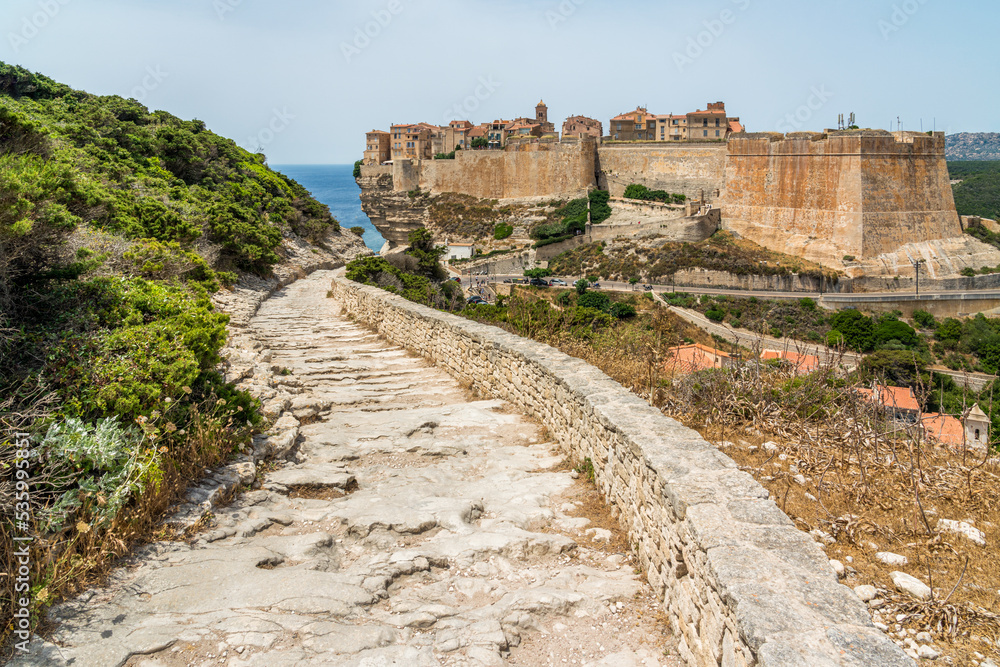 Fototapeta premium The city of Bonifacio perched on its scenographic cliffs on a sunny summer day. Southern Corse, France.