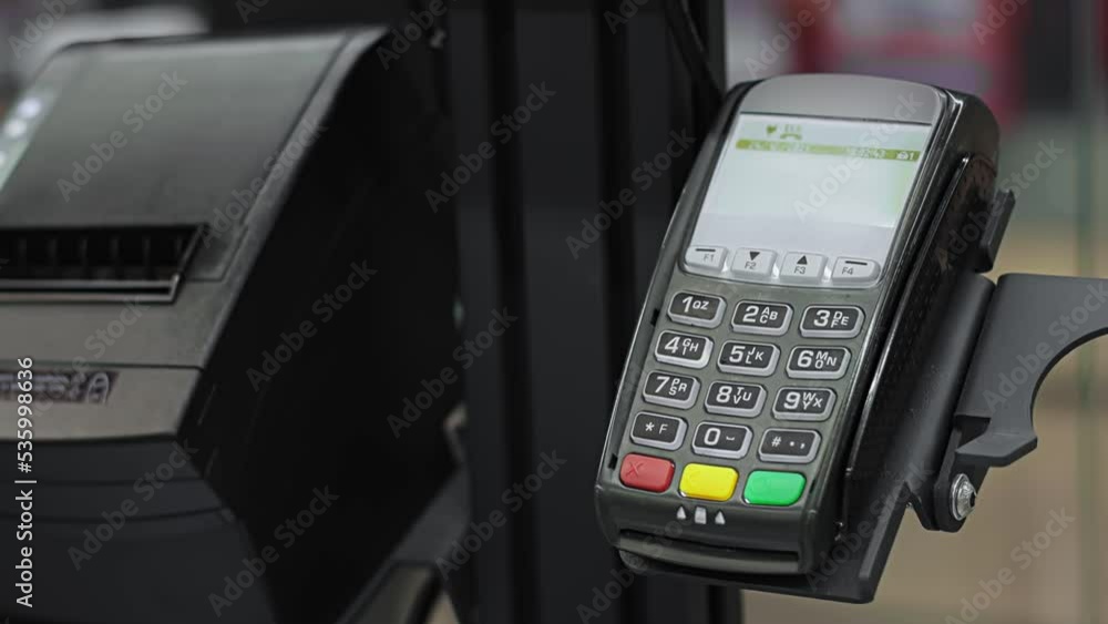 Closeup cashless payment terminal. Electronic device for bank credit plastic cards. Purchase of goods at checkout in supermarket. Shopping at mall and store. Closeup cashless payment terminal. Electronic device for bank credit plastic cards. Purchase of goods at checkout in supermarket. Shopping at mall and store.