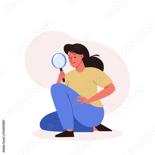 Woman holding a magnifying glass in her hands