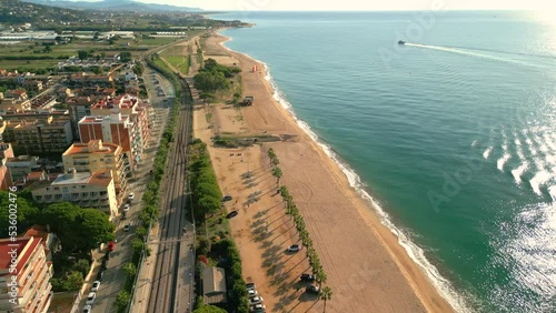 Malgrat  de Mar Santa Susanna Costa del Maresme aerial images of the beach  Boat in the middle of the ocean with the beach in the background photo