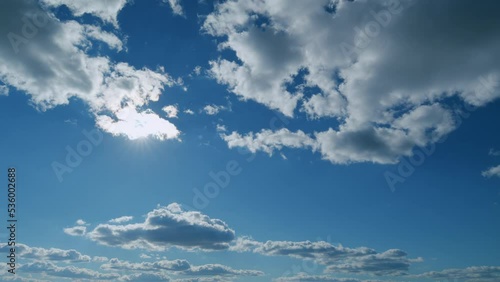 Solar energy concept of bright sun ray. Building clouds and sun rays breaking through cloud mass. Timelapse.