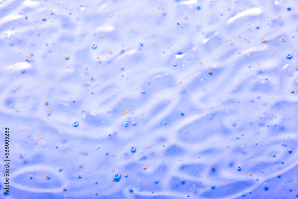 Cosmetic gel close-up with oxygen bubbles. Textured background with microbrushes in cosmetics. Moisturizing skin serum with vitamins and collagen. Cosmetic gel close-up with oxygen bubbles. Textured background with microbrushes in cosmetics. Moisturizing skin serum with vitamins and collagen.