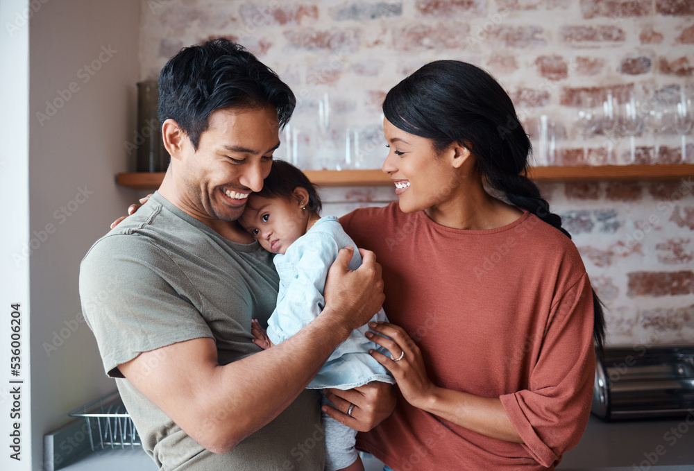 Down syndrome, happy family and baby in a kitchen, bonding and embracing in their home together. Child development, love and special needs care for disability by asian parents enjoy morning indoors