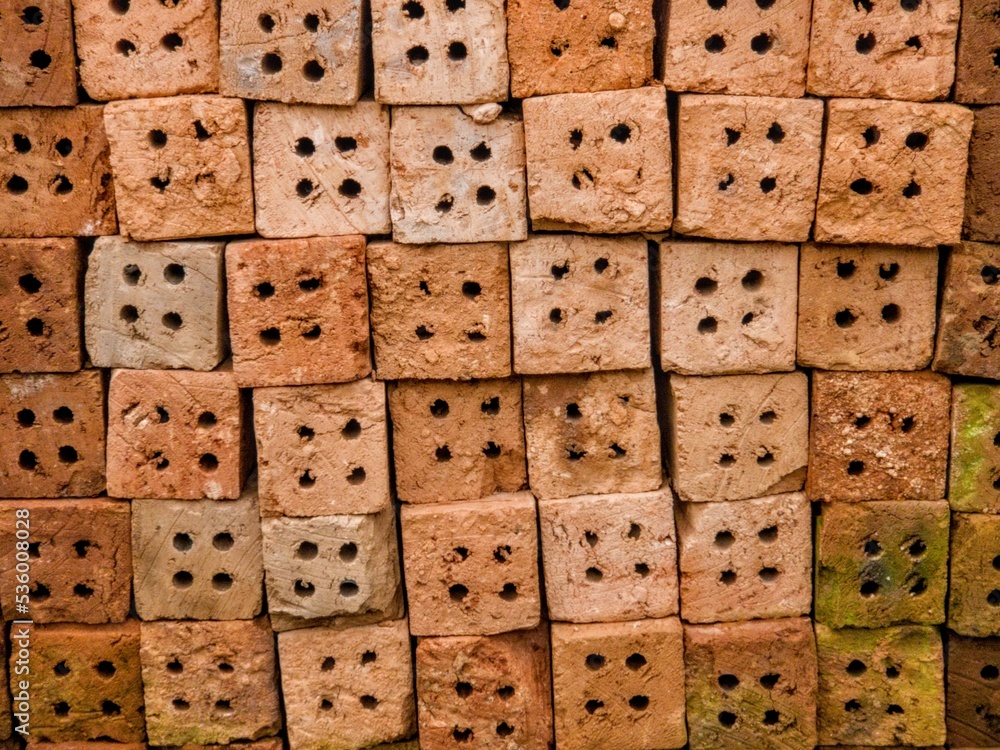 The building material bricks are made of red earth made by craftsmen with an orange texture The building material bricks are made of red earth made by craftsmen with an orange texture
