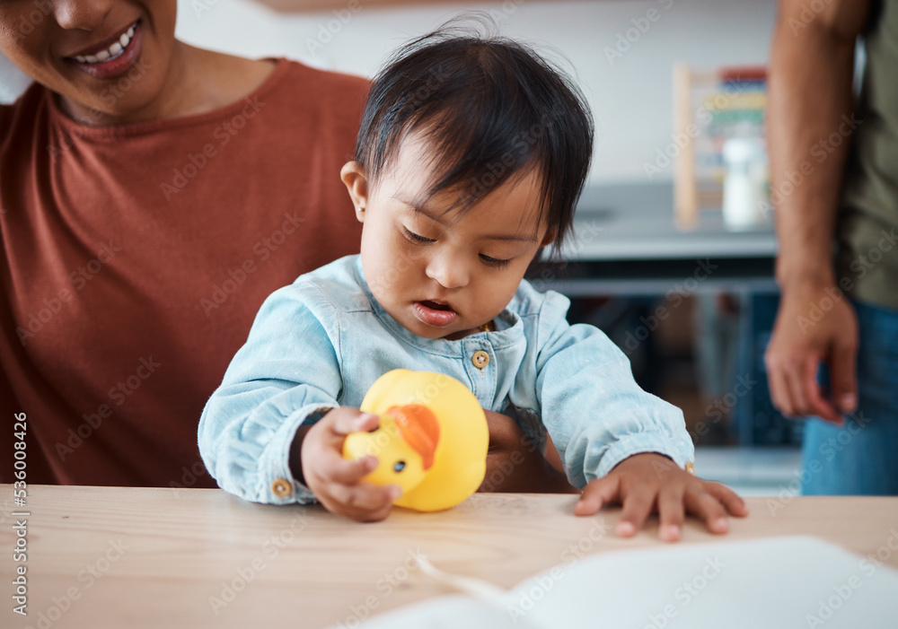 Sleeping, disability and baby with down syndrome after playing with toy asleep on his mothers lap in family home. Mama, exhausted and tired child with special needs in development with lovely parents