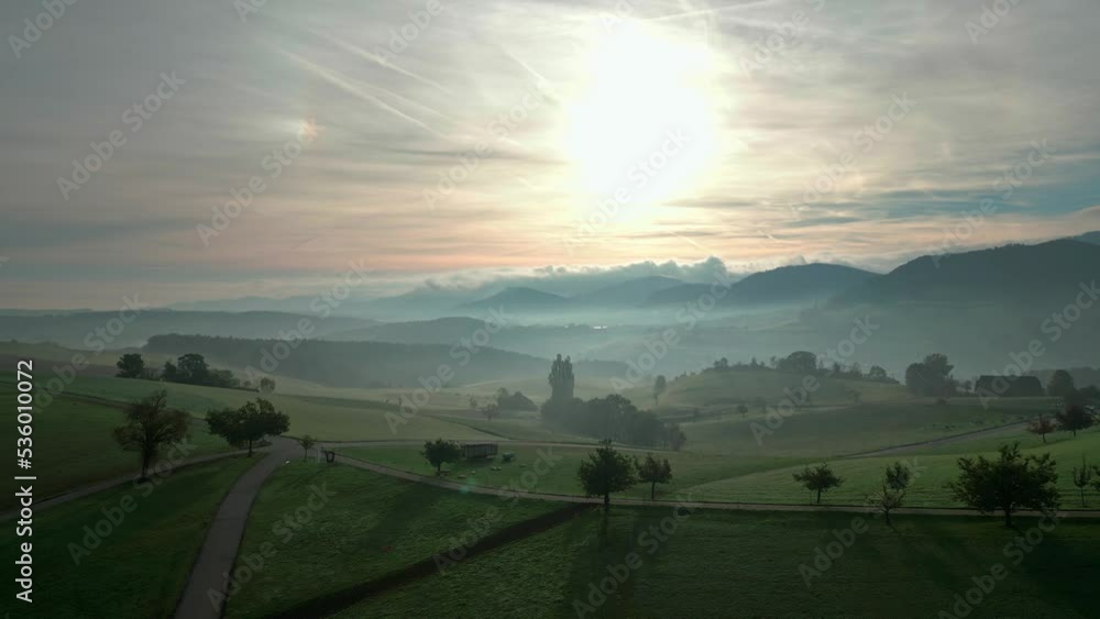 Drone flight over a field in switzerland in the beginning of autumn, while sunrise. Push in flight. Drone flight over a field in switzerland in the beginning of autumn, while sunrise. Push in flight.