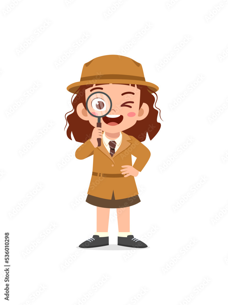 little kid wearing detective costume and holding magnifying glass Stock