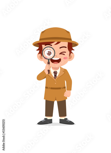 little kid wearing detective costume and holding magnifying glass