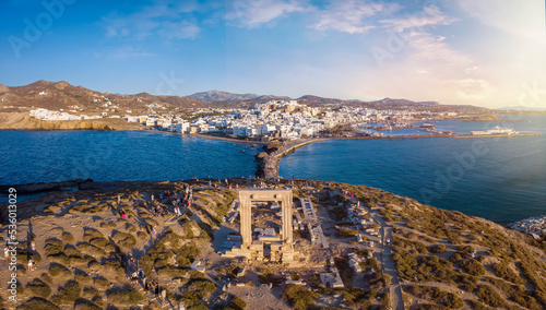 Aerial view of the famous Portara Gate at Naxos island, Cyclades, Greece, with the town behind during summer sunset time photo