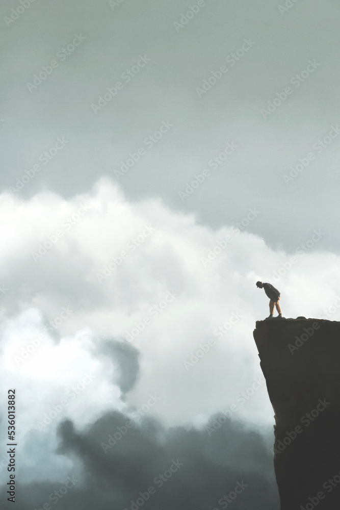 businessman looks with surprise at the height of the summit he has successfully reached businessman looks with surprise at the height of the summit he has successfully reached