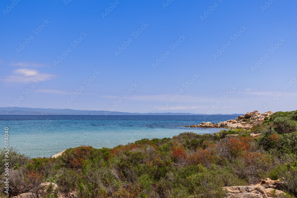 Karydi beach on Vourvourou bay in Sithonia, the central peninsula of Halkidiki surrоundеd by rοскs of intеrеsting shаpеs and covered with stunted endemic vegetation, Greece