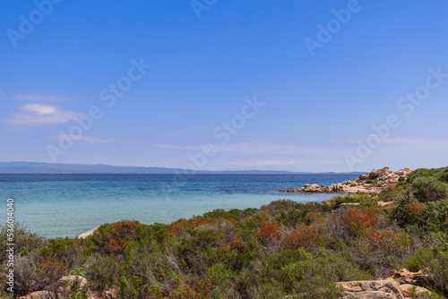 Karydi beach on Vourvourou bay in Sithonia, the central peninsula of Halkidiki surrоundеd by rοскs of intеrеsting shаpеs and covered with stunted endemic vegetation, Greece