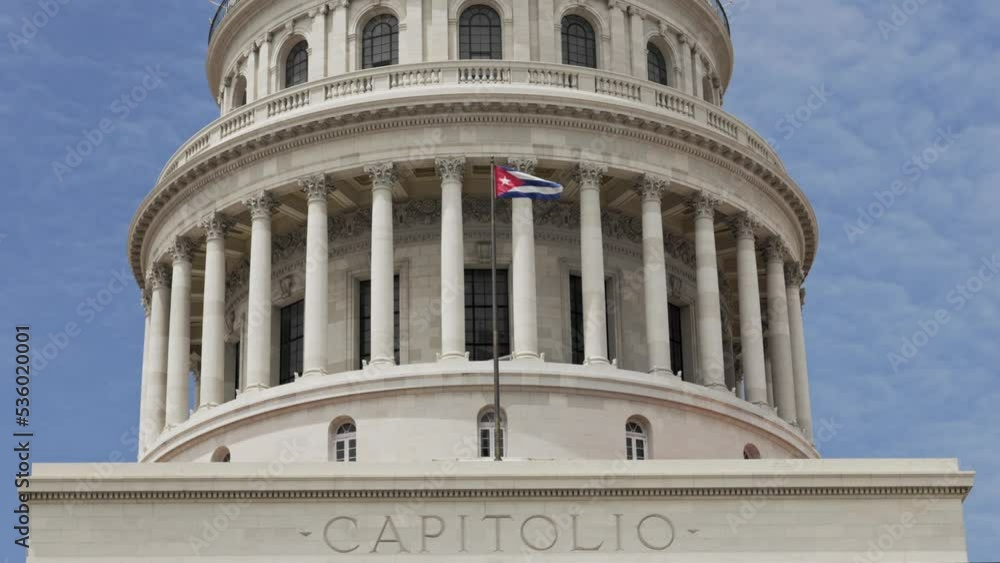 Cuban National Flag waving in the famous Capitolio in Havana in Cuba Cuban National Flag waving in the famous Capitolio in Havana in Cuba