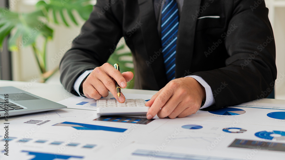 business planning Analyze investments and markets on office laptops with graphs. business planning Analyze investments and markets on office laptops with graphs.