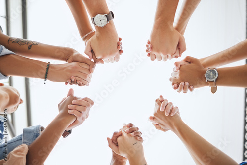 Motivation, friends and holding hands from low angle for support and care with commitment mockup. Trust, hope and solidarity in friendship with supportive people who appreciate togetherness.