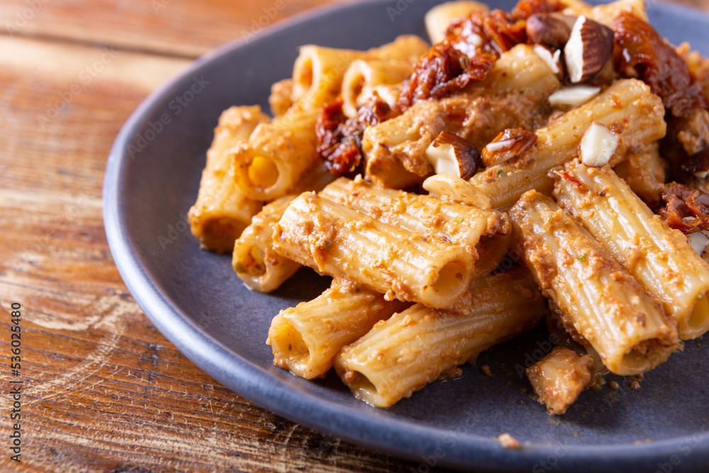 Pasta with dried tomato and almond pesto. Vegan recipe, ideal for lunch and dinner. Pasta with dried tomato and almond pesto. Vegan recipe, ideal for lunch and dinner.