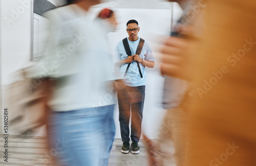 Bullying, depression and sad university student, black man and mental health problems in busy college. Social anxiety, depressed and lonely campus guy, loser and victim fail in school youth education