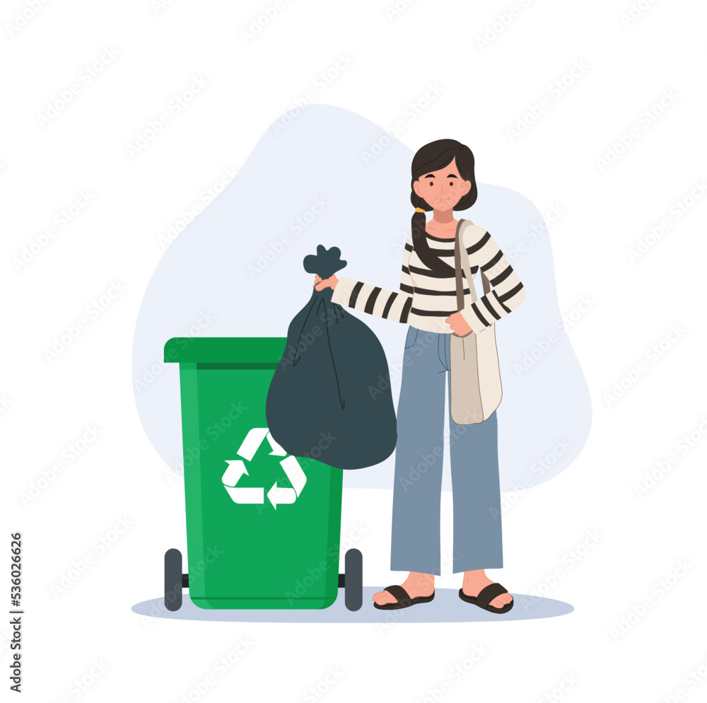 Recycle concept. Happy woman throws away trash into green trash bin
