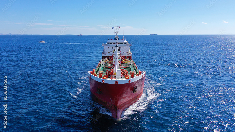 Aerial drone photo of crude oil super tanker cruising in low speed in deep blue sea of Saronic gulf near port of Piraeus, Attica, Greece Aerial drone photo of crude oil super tanker cruising in low speed in deep blue sea of Saronic gulf near port of Piraeus, Attica, Greece