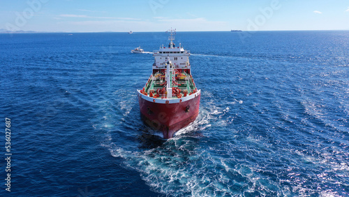 Aerial drone photo of crude oil tanker carrier cruising in deep blue open ocean sea