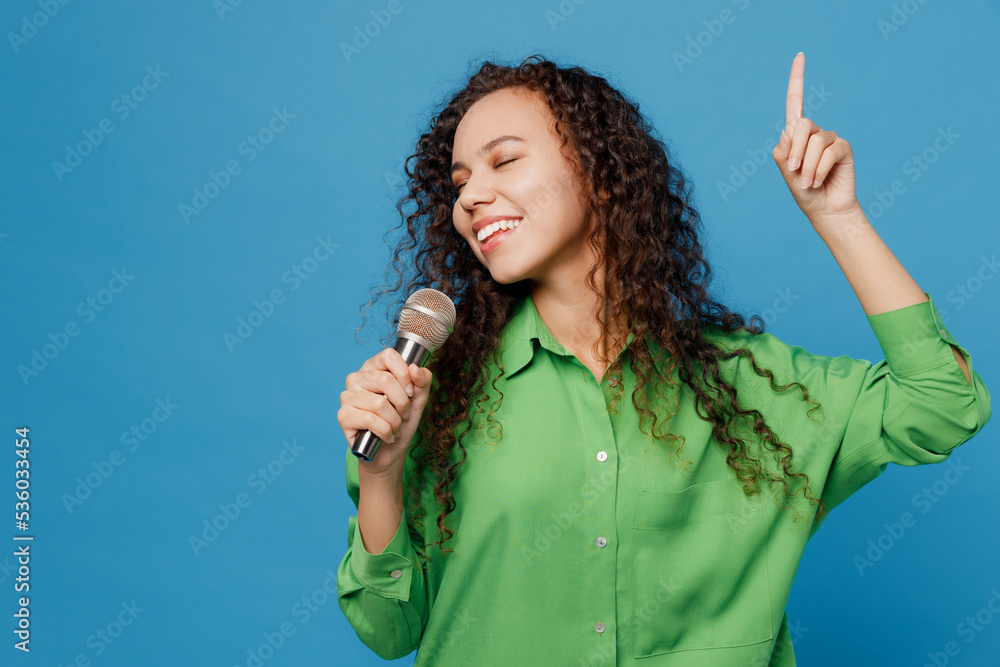 Young singer happy fun woman of African American ethnicity 20s she wear
