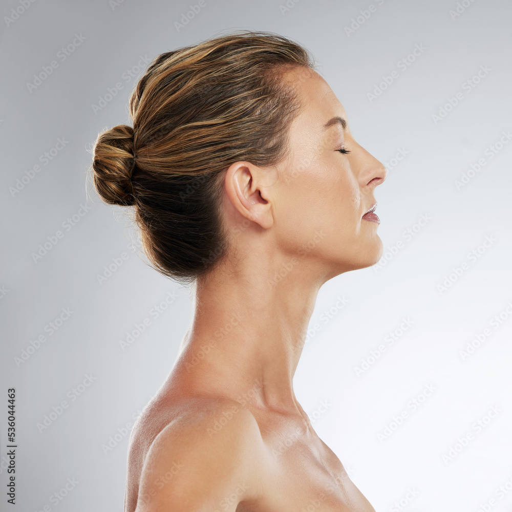 Skincare, beauty and profile of mature woman in studio with a healthy face, skin and face routine. Facial, cosmetic and model with wellness, health and self care lifestyle standing by gray background Skincare, beauty and profile of mature woman in studio with a healthy face, skin and face routine. Facial, cosmetic and model with wellness, health and self care lifestyle standing by gray background