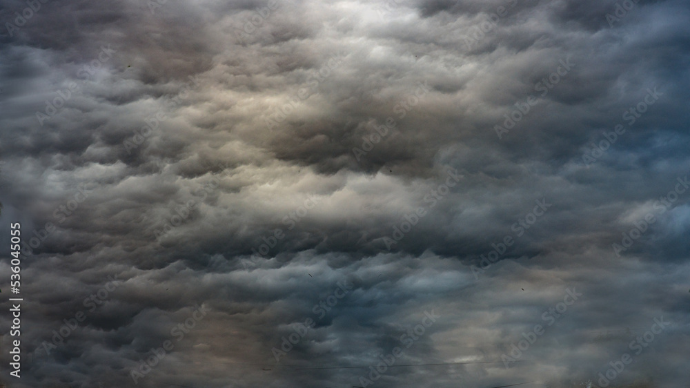 Obraz premium Texture of bright blue dramatic cloudy sky.