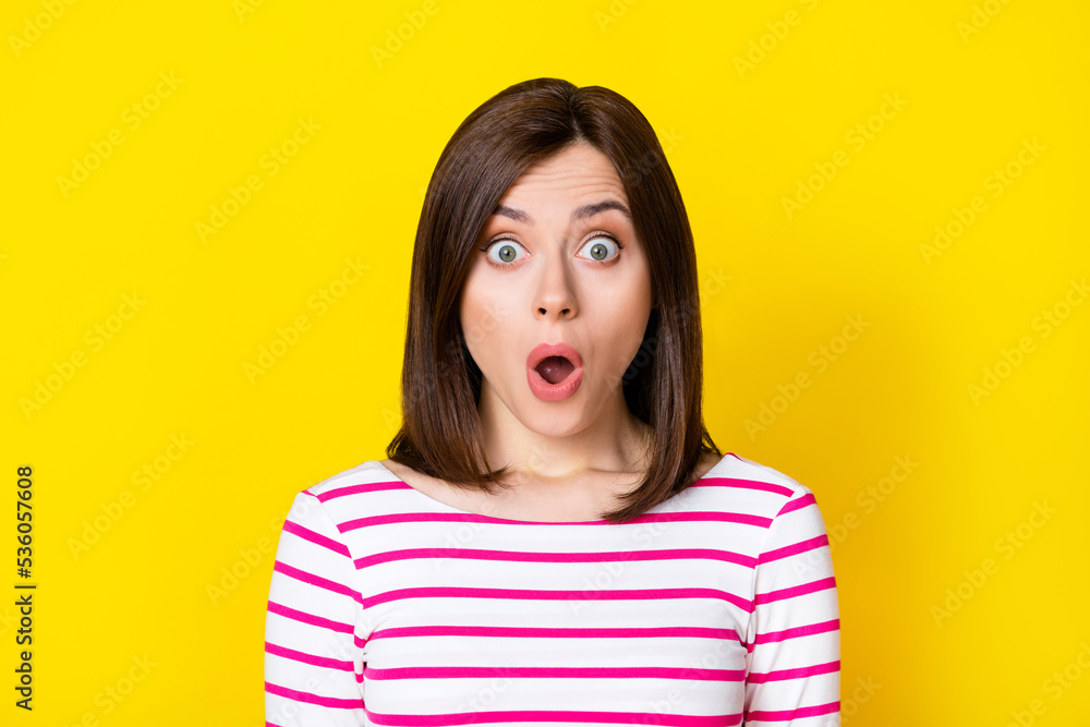Closeup photo of young excited attractive woman shocked looking you know secret isolated on yellow color background Closeup photo of young excited attractive woman shocked looking you know secret isolated on yellow color background