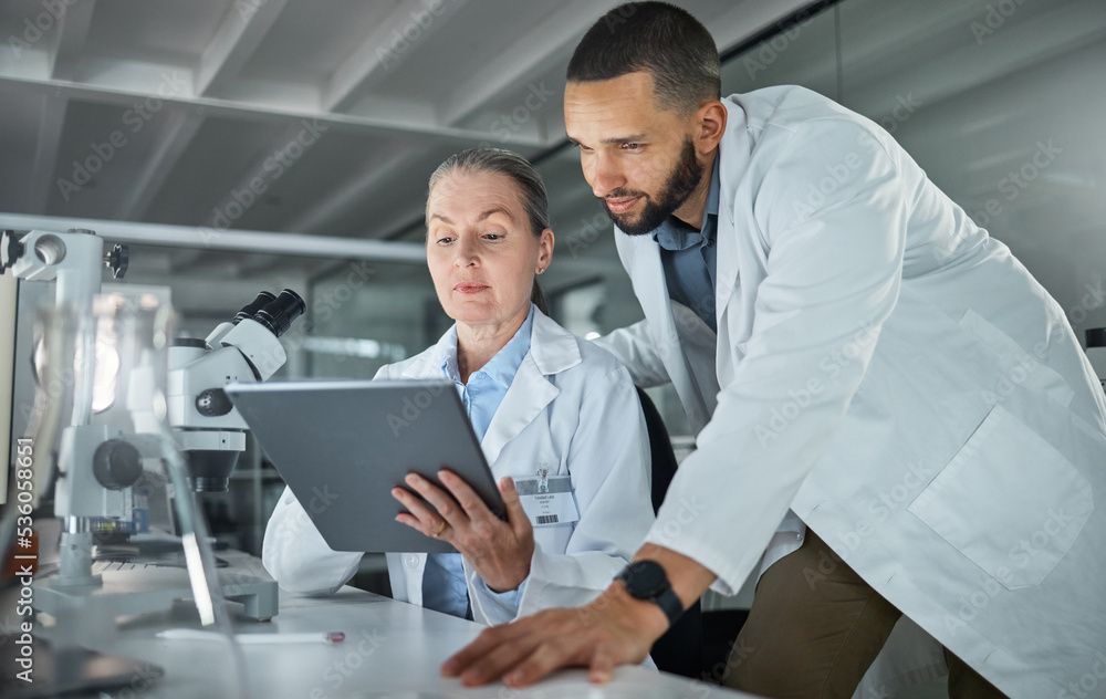 Science teamwork, tablet and scientist in digital research analysis, investigation or check medical software analytics in laboratory. Healthcare innovation biotechnology expert people reading report Science teamwork, tablet and scientist in digital research analysis, investigation or check medical software analytics in laboratory. Healthcare innovation biotechnology expert people reading report