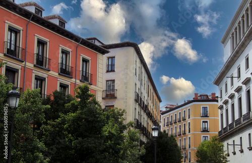 Exterior view of colorful historical buildings in Central Madrid, Spain, Europe. Traditional European street scene in the Austrias neighborhood of the Spanish capital.