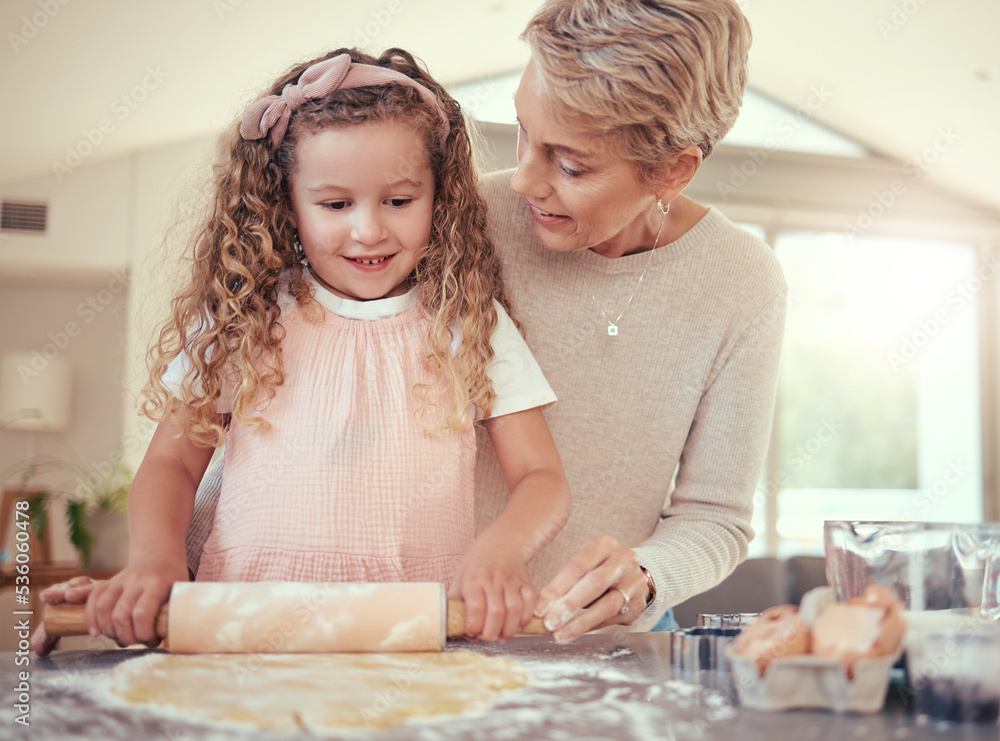 Family, learning and girl baking with grandmother in a kitchen, bonding while prepare cookies together. Teaching, independence and child development by senior woman showing child how to bake snack Family, learning and girl baking with grandmother in a kitchen, bonding while prepare cookies together. Teaching, independence and child development by senior woman showing child how to bake snack