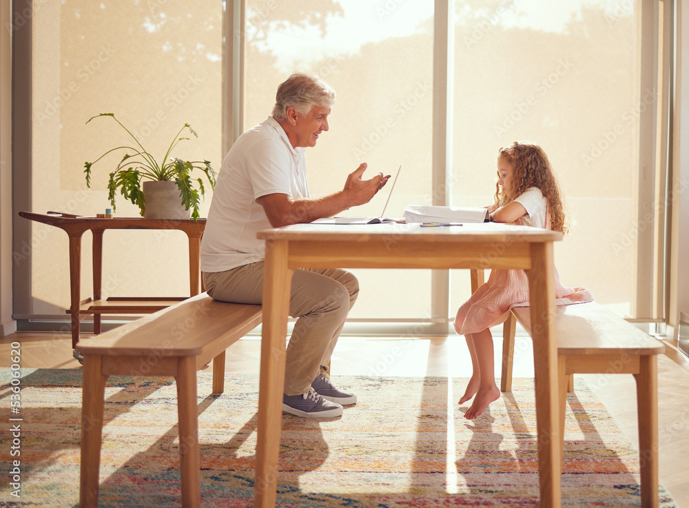 Girl homework, internet research and grandfather helping a kid with school work with books at a table in their house. Child writing and learning education in notebook with elderly person on laptop Girl homework, internet research and grandfather helping a kid with school work with books at a table in their house. Child writing and learning education in notebook with elderly person on laptop