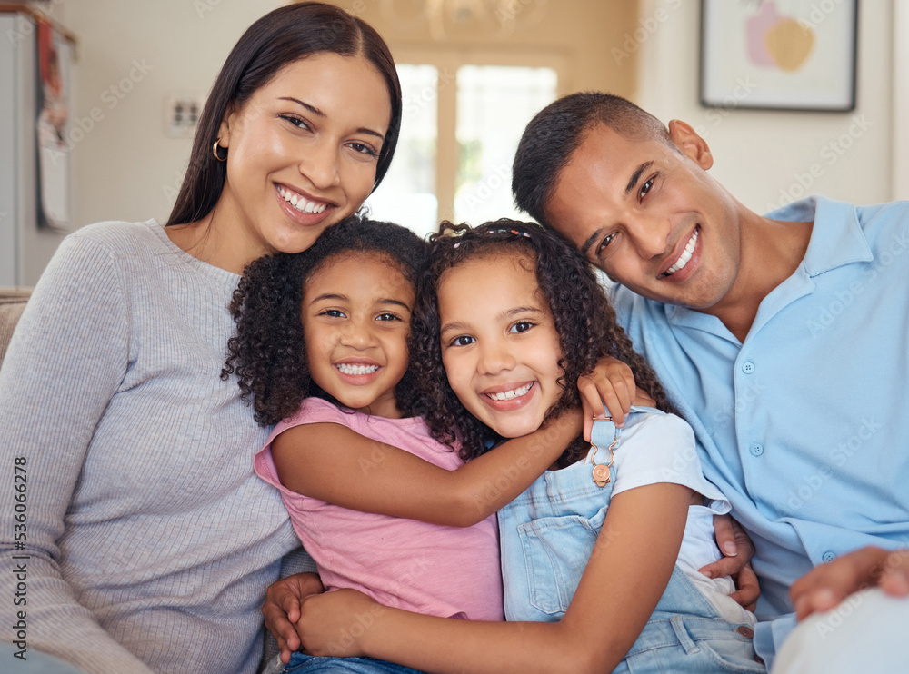 Portrait, happy family and living room sofa hug, smile and bonding for love, happiness and joy together at home. Parents of mother, father and girl children or kids on lounge couch smiling at house Portrait, happy family and living room sofa hug, smile and bonding for love, happiness and joy together at home. Parents of mother, father and girl children or kids on lounge couch smiling at house