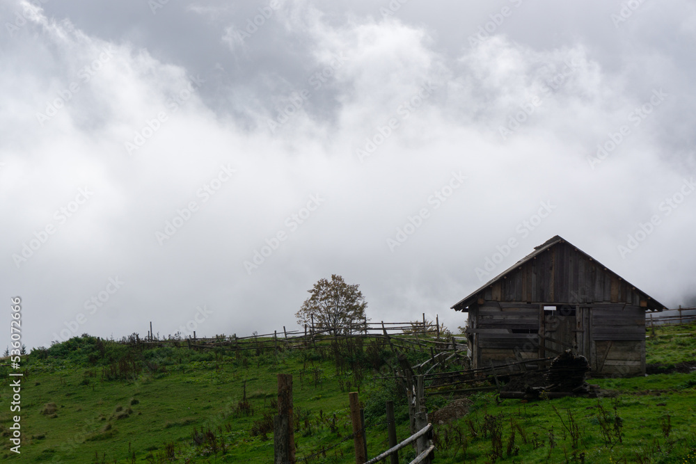 Old wooden house in the mountains. Carpathian mountains. Shepard cottage. Old wooden house in the mountains. Carpathian mountains. Shepard cottage.