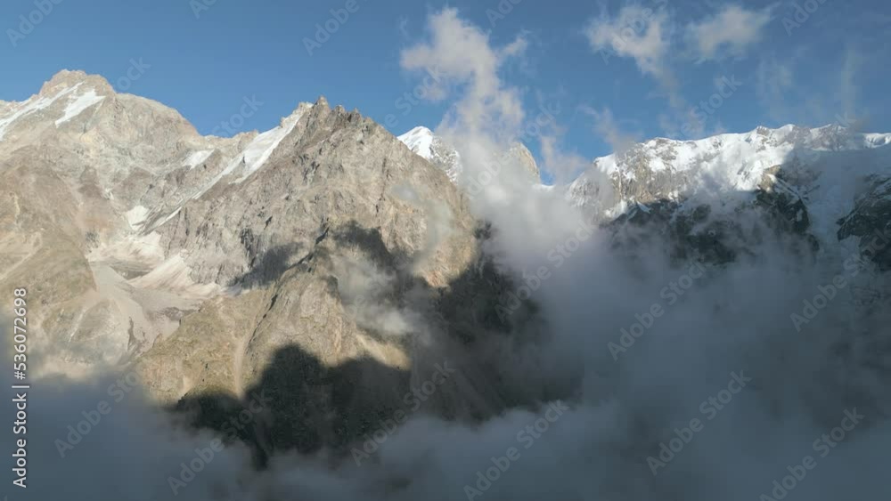 Mountain Range Silhouette Sunrise Aerial View. Wild Nature Landscape. Dramatic Sky, Clouds Float. Time Lapse Drone Flight Footage 4K (UHD) Mountain Range Silhouette Sunrise Aerial View. Wild Nature Landscape. Dramatic Sky, Clouds Float. Time Lapse Drone Flight Footage 4K (UHD)
