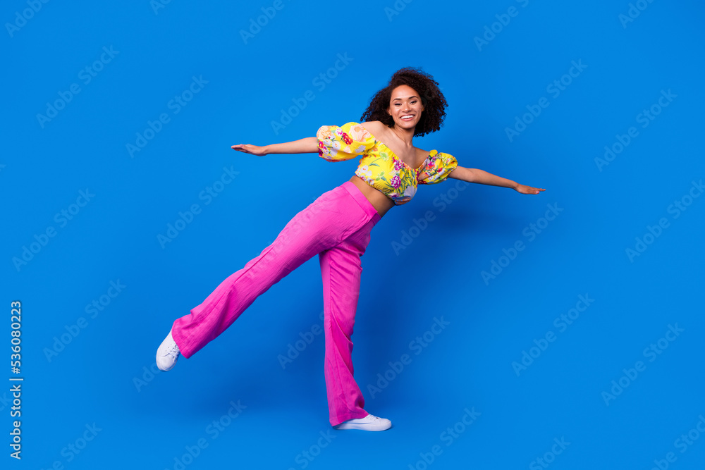 Full size portrait of excited cheerful lady arms wings enjoy good mood isolated on blue color background