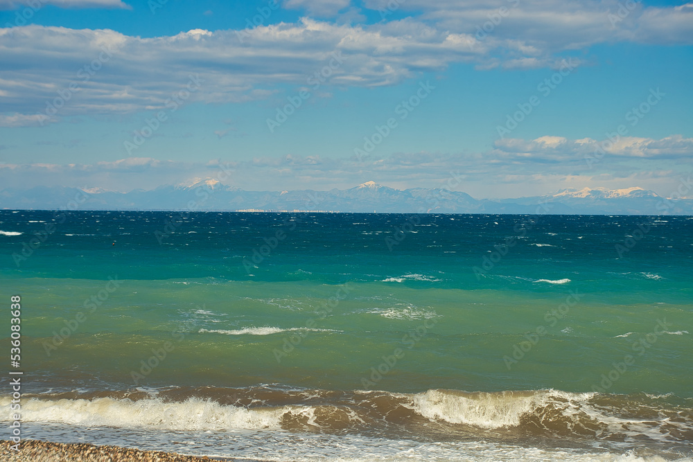 Winter cold Antalya bay of Mediterranean sea scenic with colorful dirty sea water
