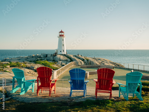 Obraz na płótnie Colorful Adirondack chairs and Peggys Cove Lighthouse, Peggys Cove, Nova Scotia, Canada w salonie