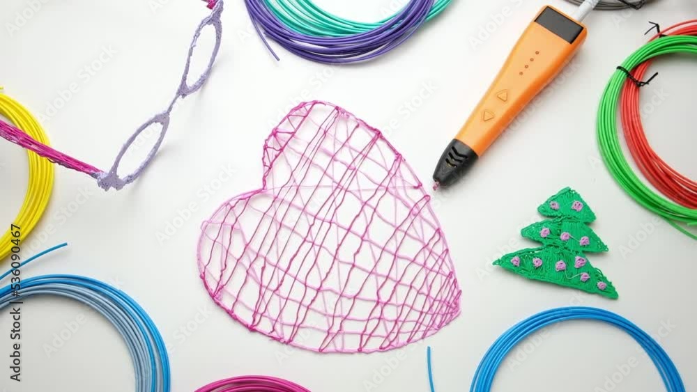 3d Pen. Printing with Colored Plastic Wire Filament. Child making a Christmas Three, Heart shape drawing with 3D pen. Artwork, Robotics. STEAM, STEM education. Modern Technologies. Study at home 3d Pen. Printing with Colored Plastic Wire Filament. Child making a Christmas Three, Heart shape drawing with 3D pen. Artwork, Robotics. STEAM, STEM education. Modern Technologies. Study at home