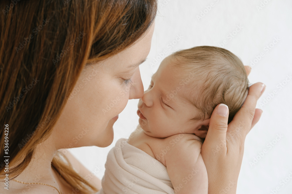 Mother touching noses with infant Mother touching noses with infant