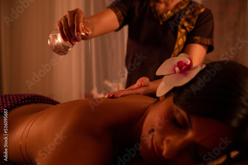 Thai woman preparing to massage a young woman