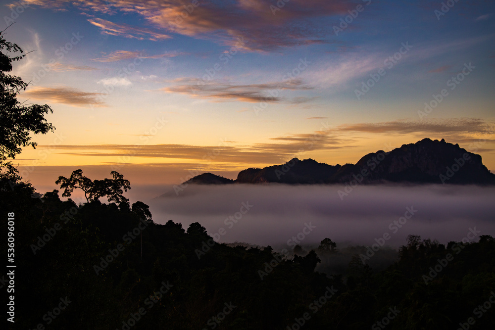 Fototapeta premium Sunrise sea of fog above Khao Sok national park, Surat Thani, Thailand