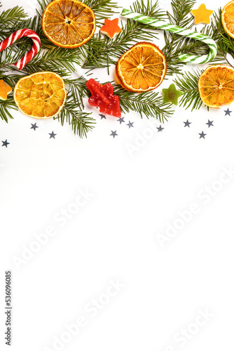 Christmas card with fir branches and Christmas decorations.