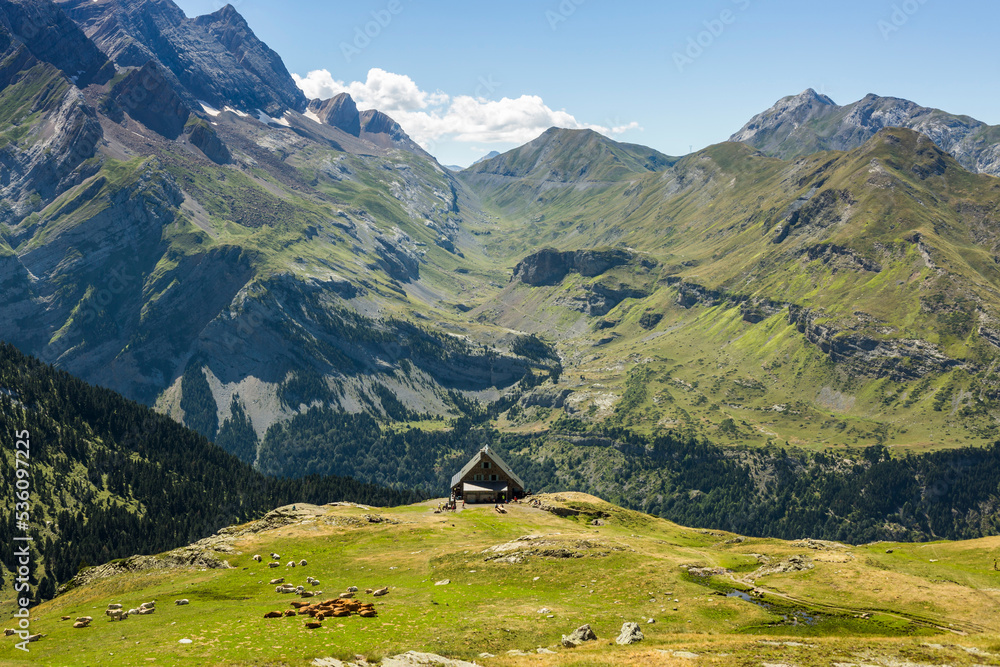 House against mountain ridge in summer House against mountain ridge in summer